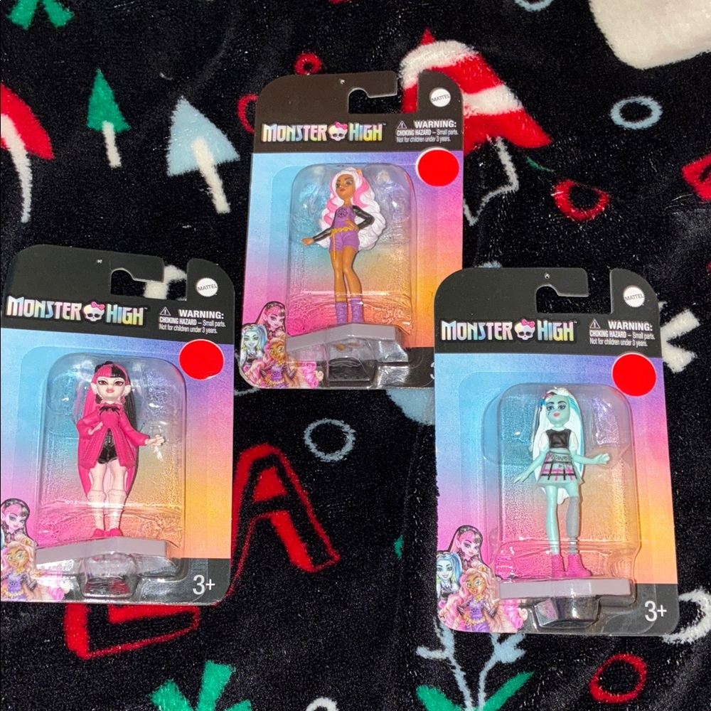 Monster High Figures in Pink, Purple, and Blue